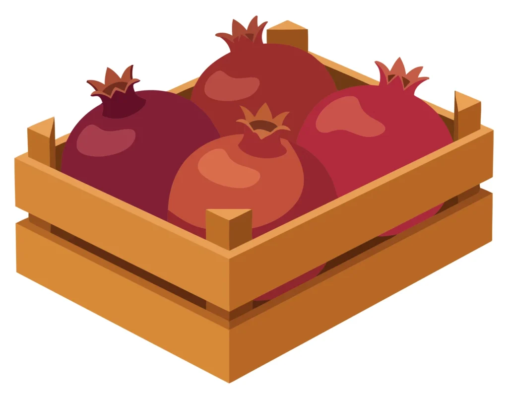 a wooden crate filled with fresh ripe pomegranates isolated on white background