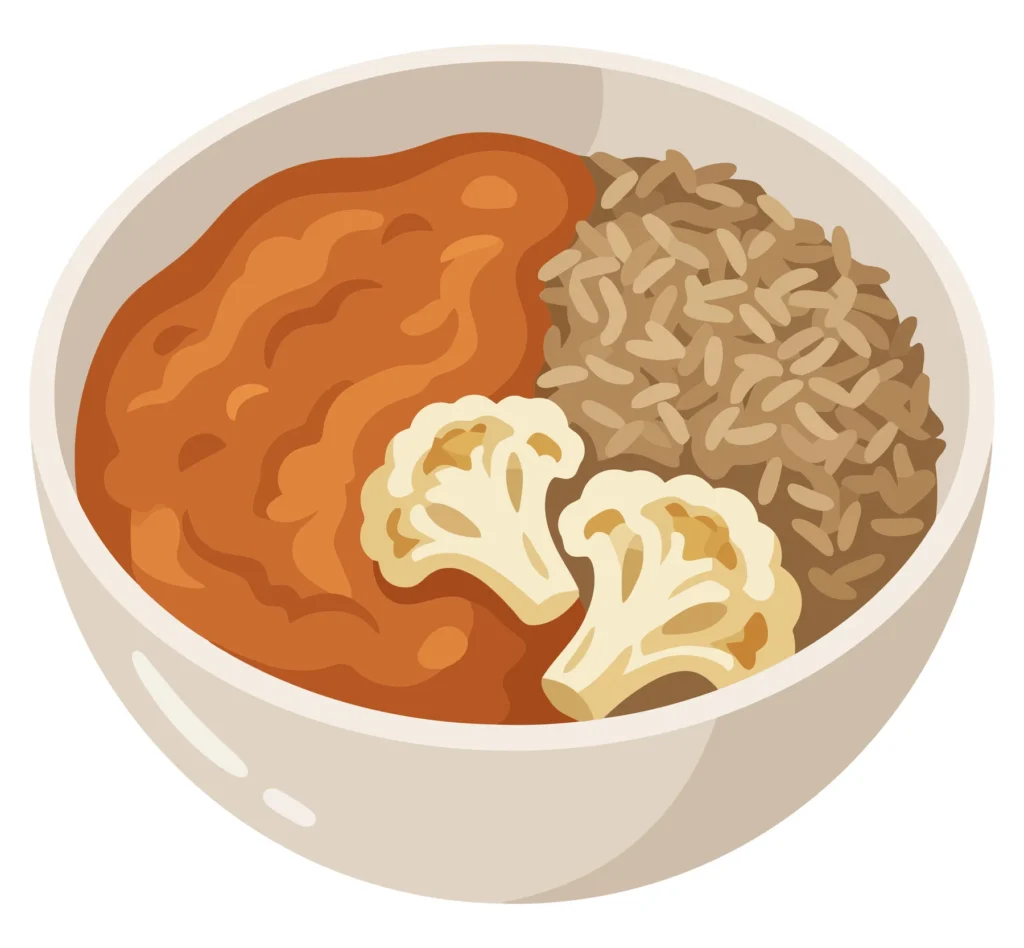 bowl of curry with cauliflower and rice