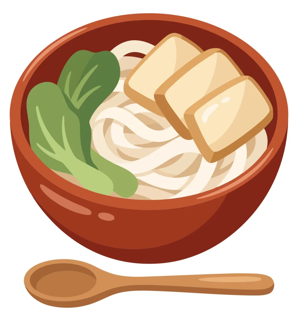 bowl of udon noodles with tofu and bok choy