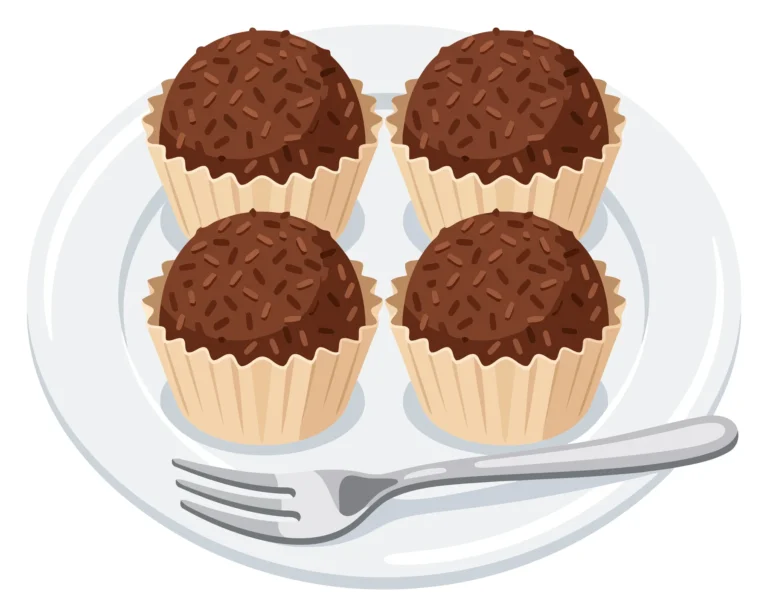 four delicious chocolate brigadeiros in paper cups on a white plate with a fork