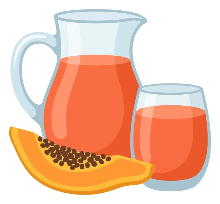 fresh papaya juice in a glass pitcher and cup with a slice of papaya