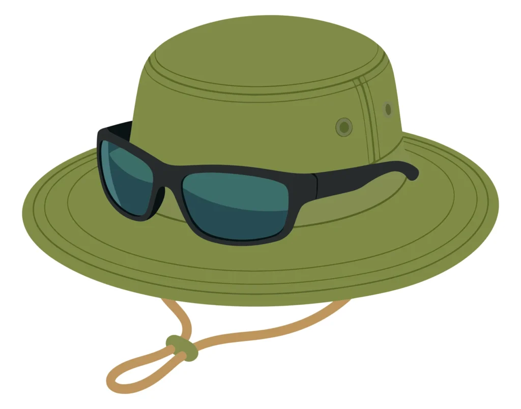 Green Bucket Hat And Sunglasses Isolated On White Background green bucket hat and sunglasses isolated on white background