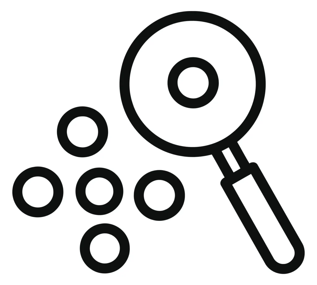 magnifying glass over a group of circles icon, representing data segmentation, audience analysis, diversity, or finding patterns in a simple