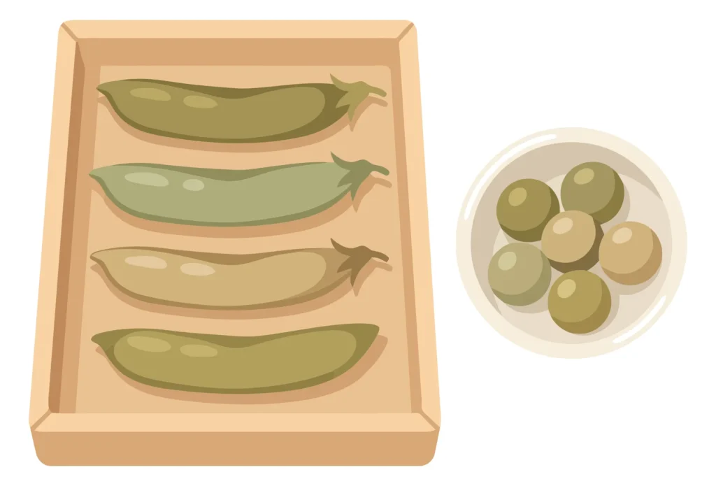 pea pods in a wooden tray and peas in a small bowl isolated on white background