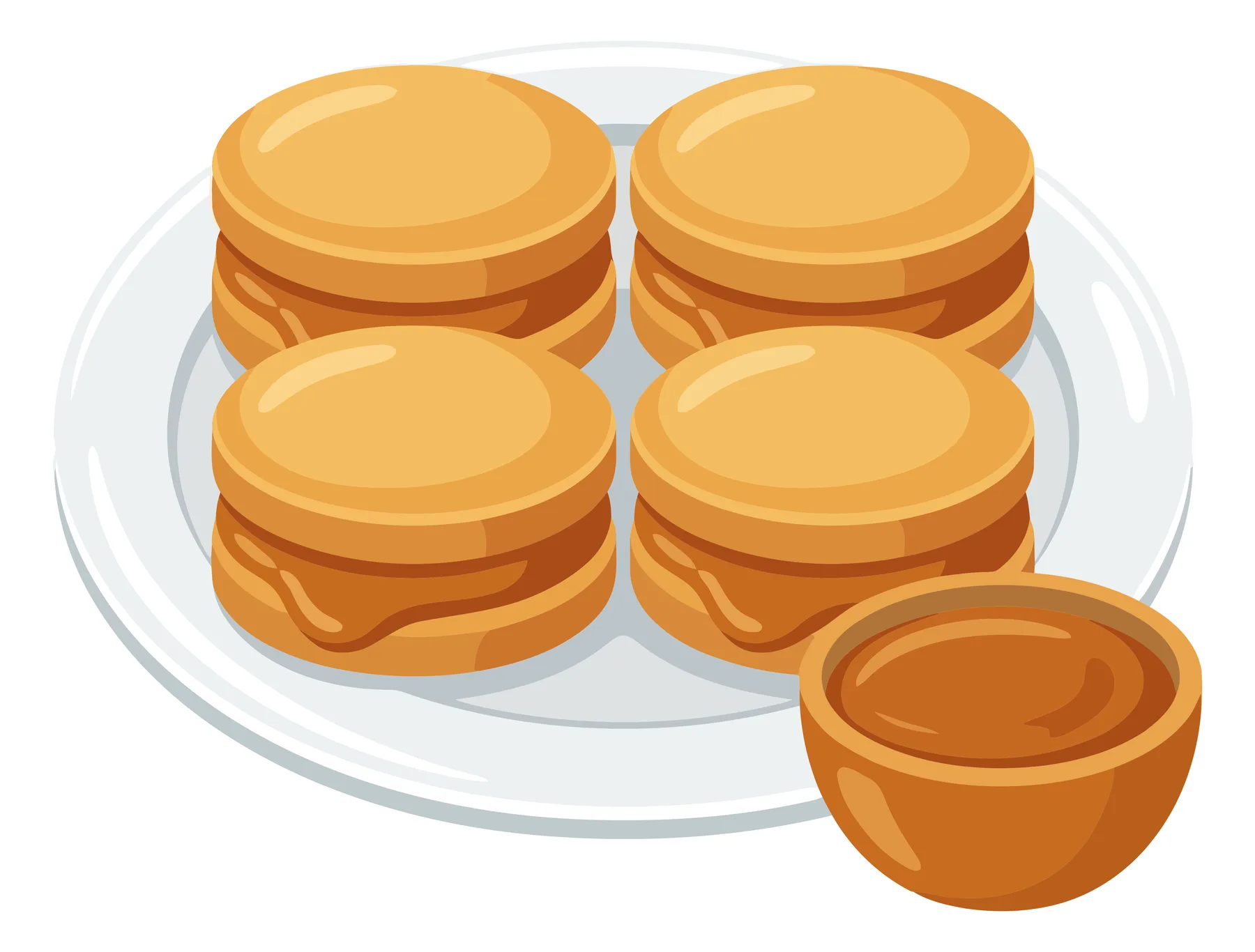plate of layered biscuits with caramel sauce and small bowl of sauce