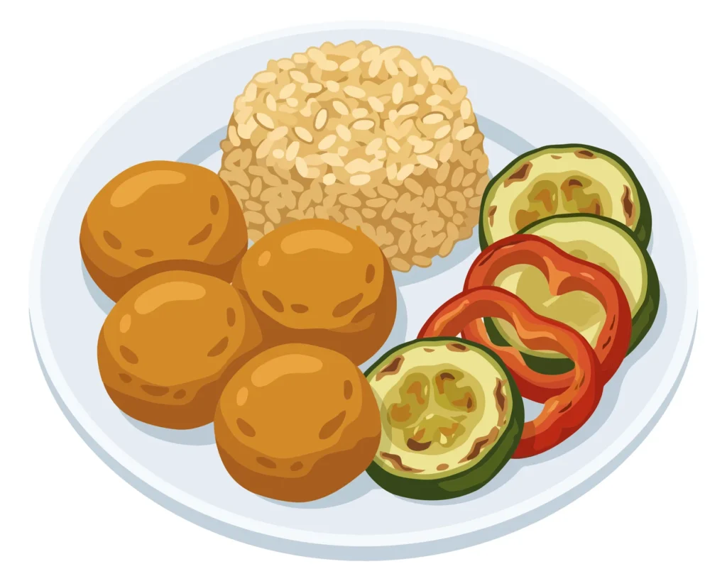 Colorful plate of meatballs, rice, and sliced vegetables plate with meatballs, rice and vegetables