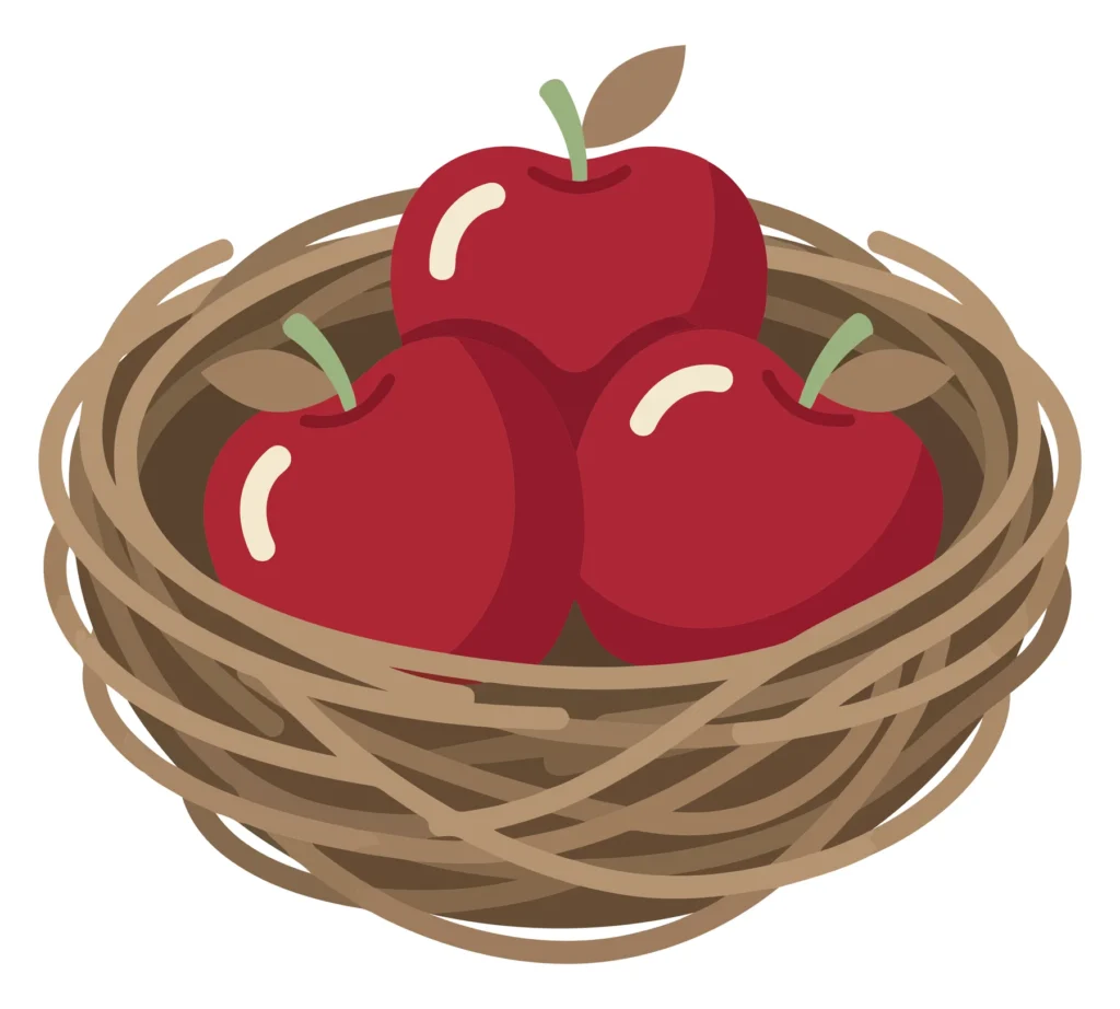 three red apples in a woven basket
