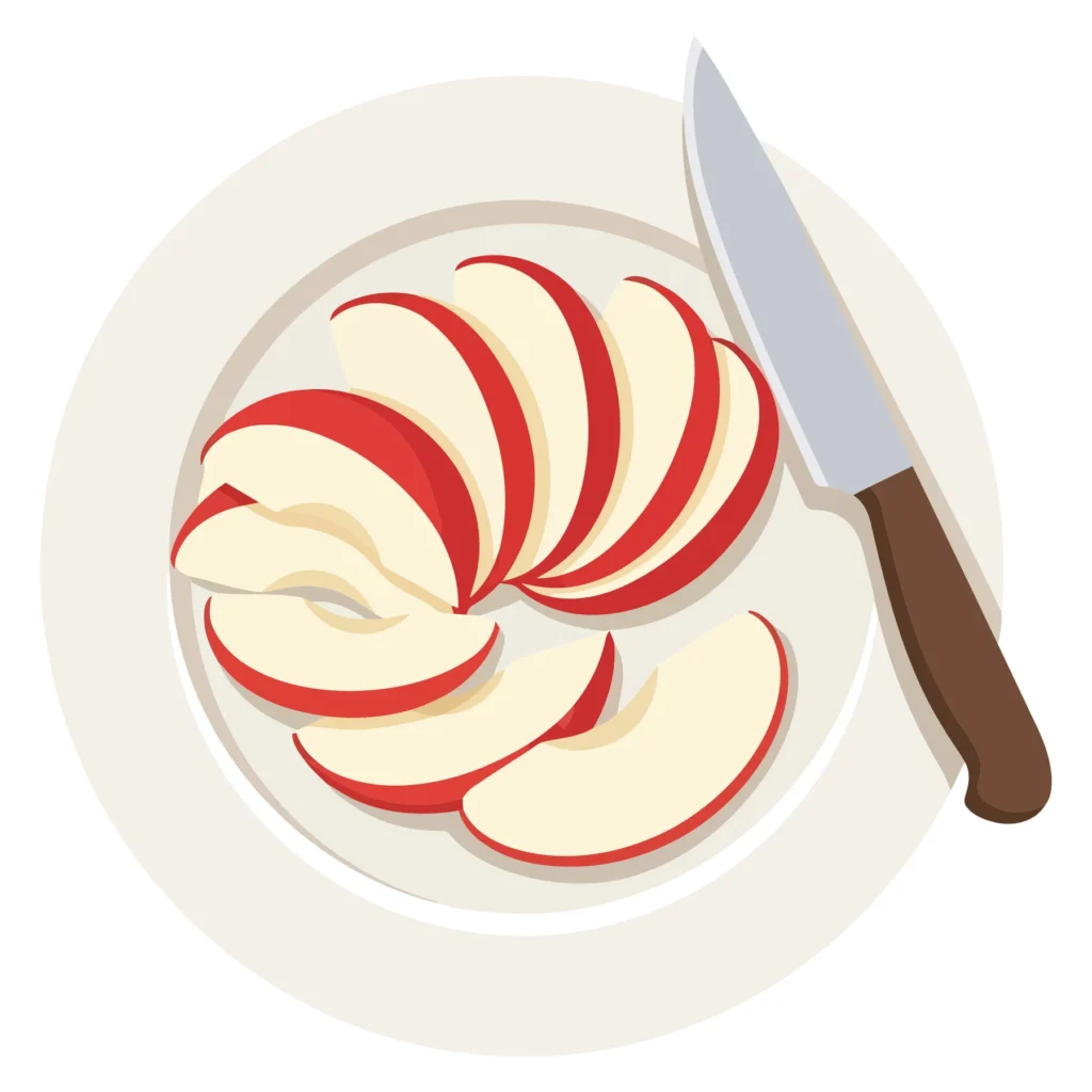 Sliced Red Apple on White Plate with Kitchen Knife top view of sliced red apple on a white plate with a kitchen knife