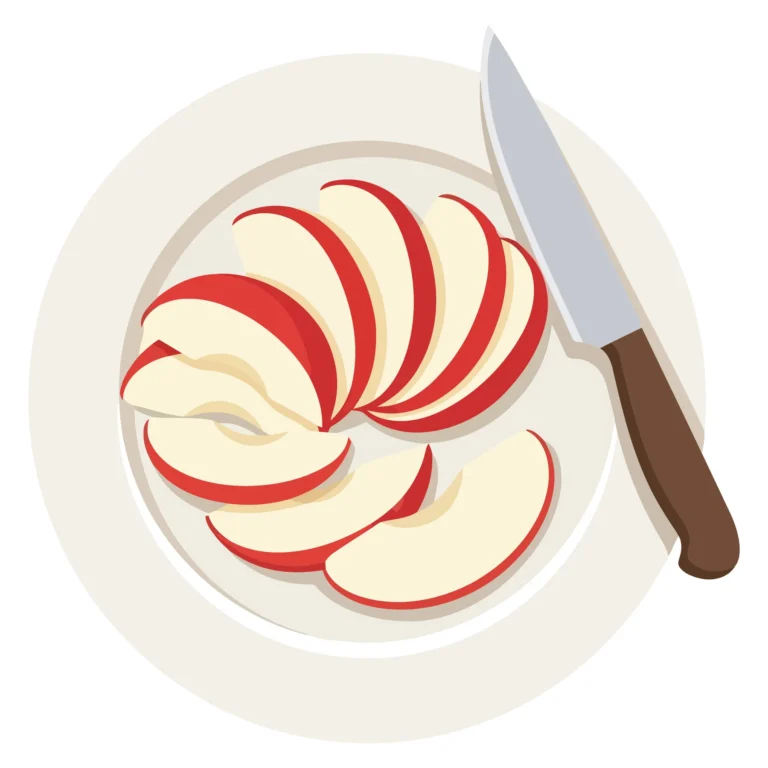 top view of sliced red apple on a white plate with a kitchen knife
