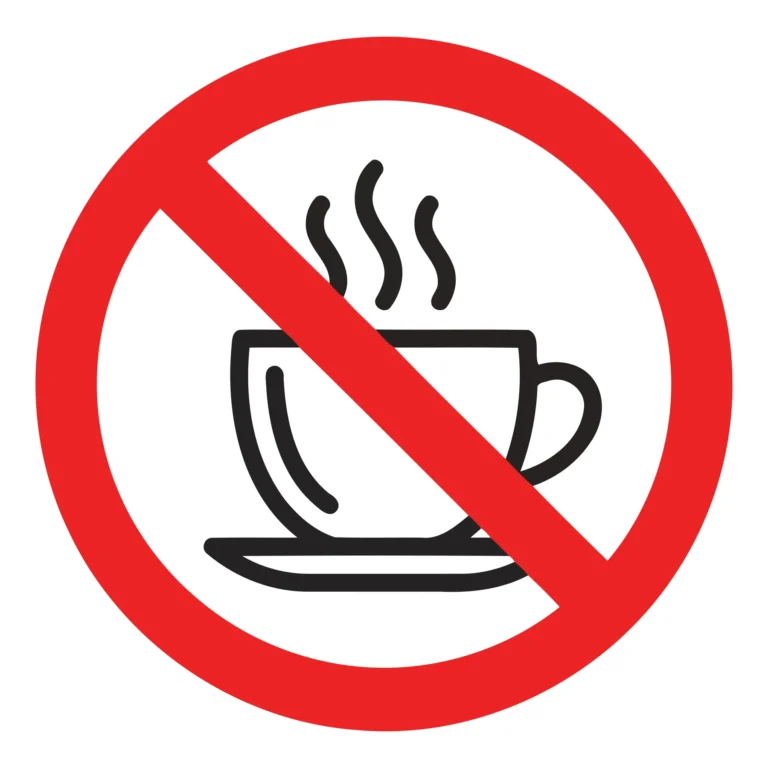 A red prohibition symbol crossed over a cup of coffee with steam
