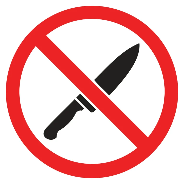 Red prohibition circle with crossed-out knife icon