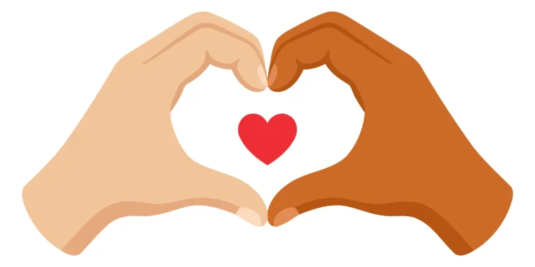 Two hands forming a heart shape with a red heart inside