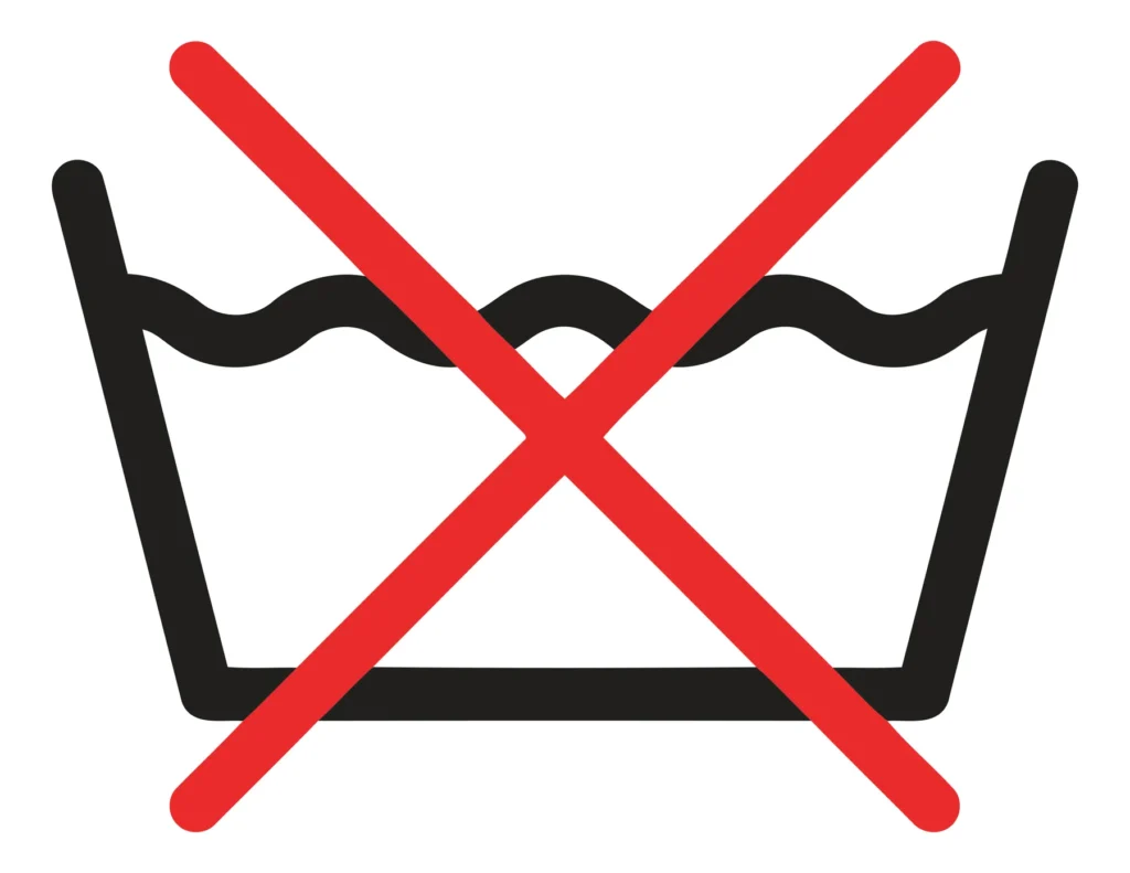 A crossed-out washing machine icon with water waves indicating no washing required