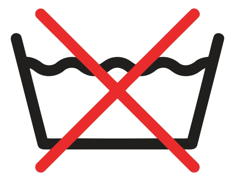 A crossed-out washing machine icon with water waves indicating no washing required