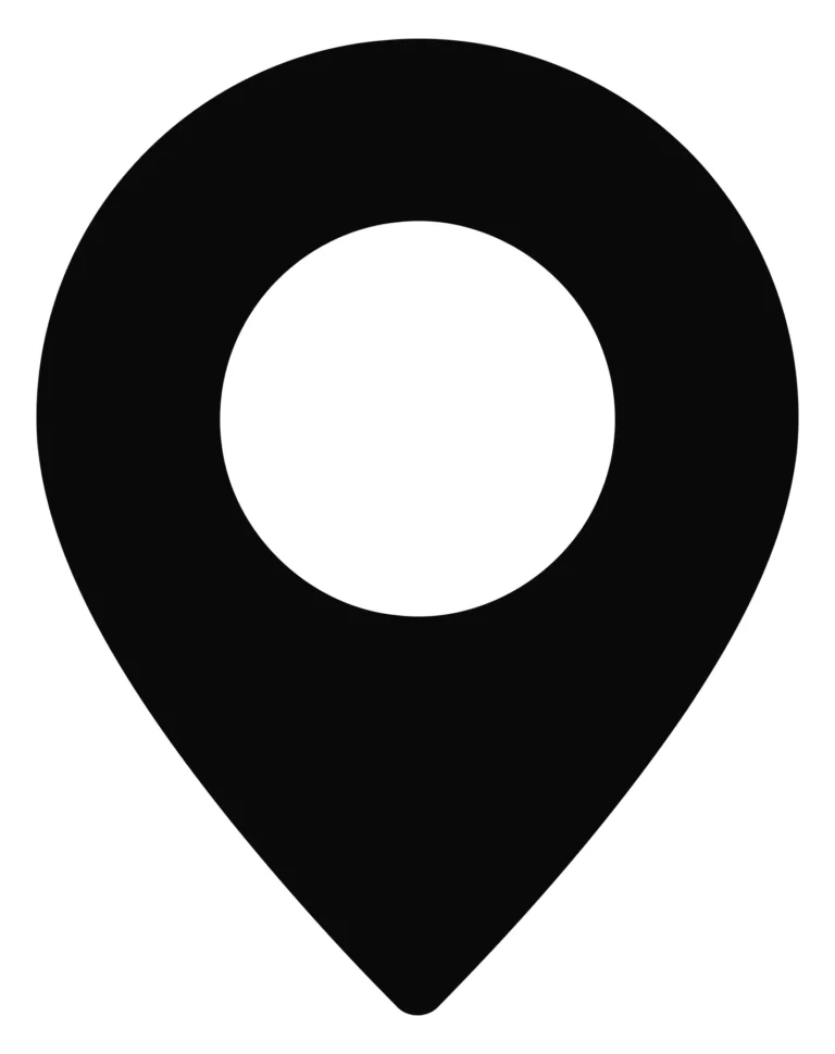 A minimalist black and white pin icon with a circular hollow detail on top, representing a location marker
