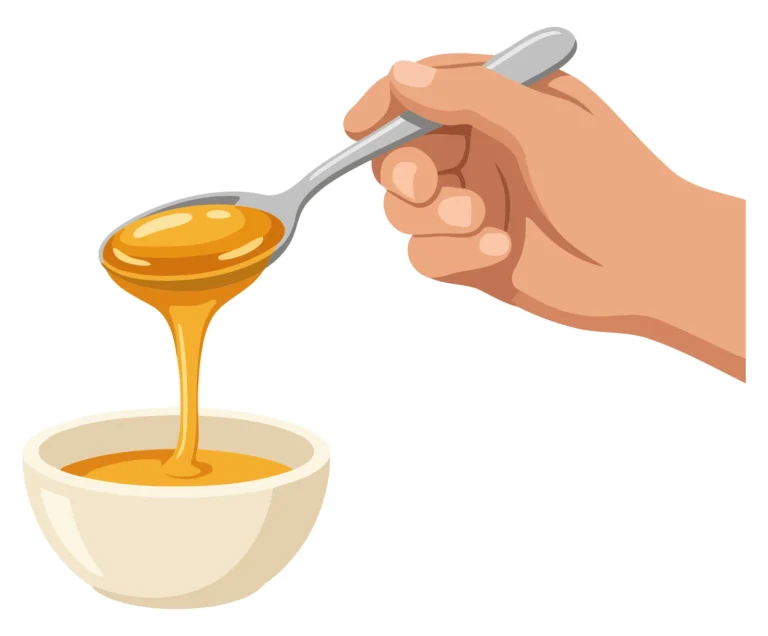 Hand pouring honey from spoon into bowl